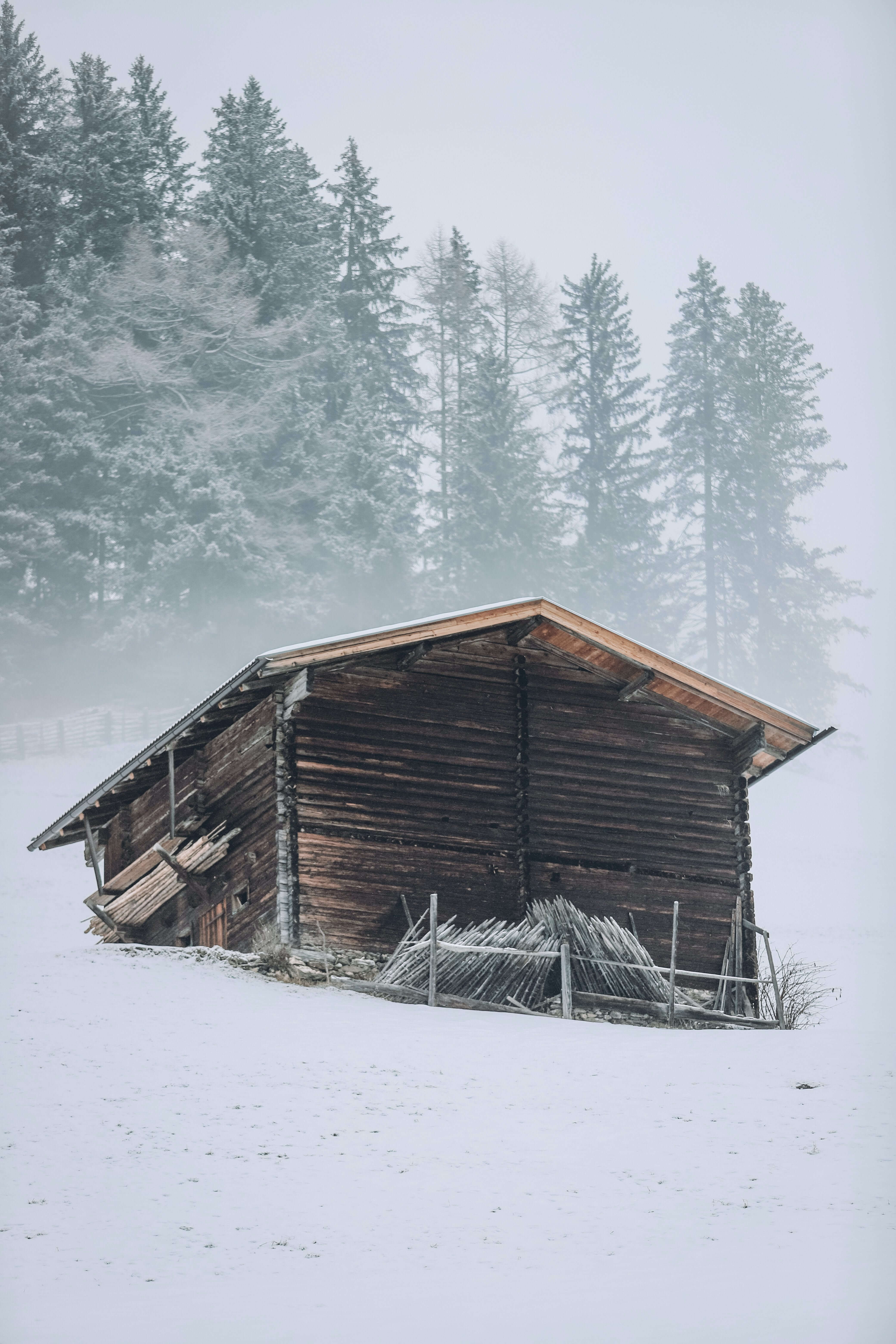 Mountain house over snowy hill